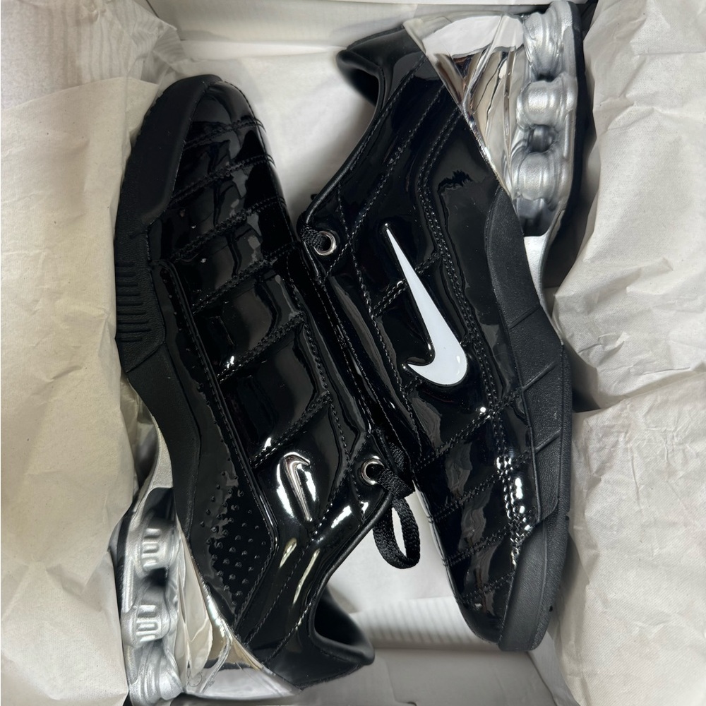 Nike Shiny Black Sneakers with Metallic Accents